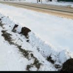 В Велиже снегоуборочная машина испортила газон